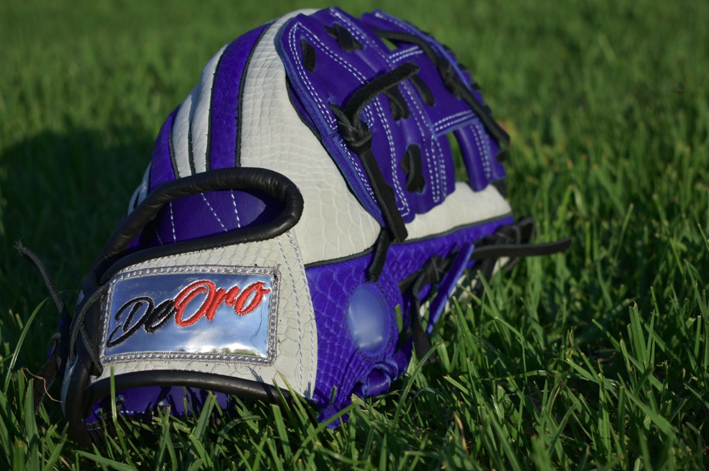 Look at thiscustom orders! 🤯 This purple and white snakeskin combo is proof that if you can dream it, we can build it. From the chrome DeOro patch to the premium textured leather, this glove is pure royalty on the diamond.Keep your hand on the gold and your head in the game. 🏆#deorosports #customgloves #baseball #softball #fyp