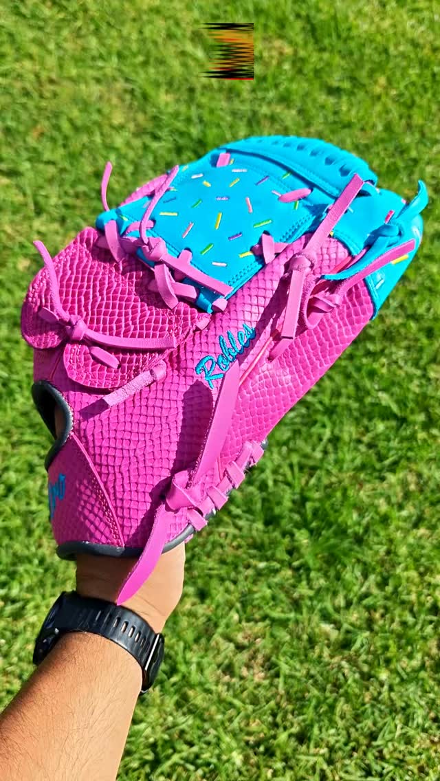 Unapologetically loud. 💗🐍 This custom masterpiece features a striking hot pink snakeskin textured shell paired with a sharp pop of teal leather on the finger hoods, complete with clean sprinkle embroidery details. Built for the players who want all eyes on them when they make the play.Rate this loud colorway from 1-10! 👇#deorosports #customgloves #baseball #softball #fyp #snakeskinleather #baseballlife #glovelove #baseballswag