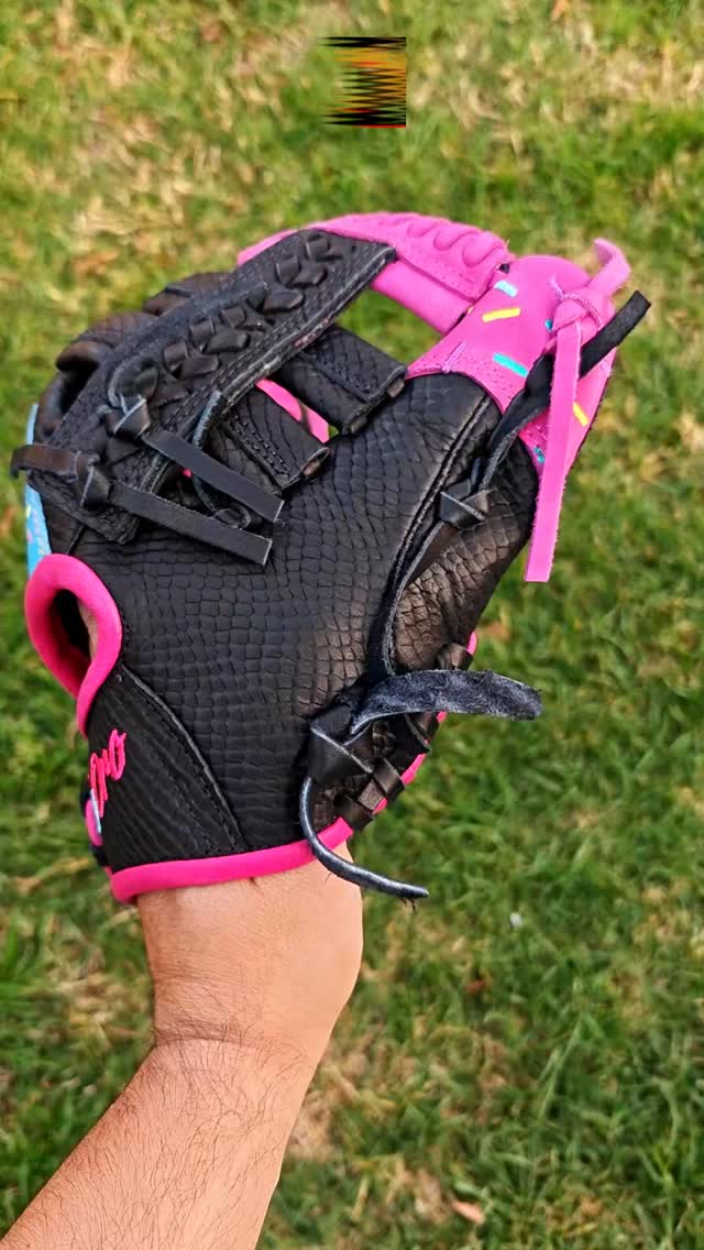 Stealthy shell, vibrant details. 🥷🧁 This custom build pairs a textured black snakeskin leather base with a striking hot pink wrist opening and matching pink finger hoods. Look closer and you'll catch that ice-blue thumb accent complete with custom ice cream embroidery.The perfect mix of a mean look with a sweet finish.Rate this combination from 1-10! 👇#deorosports #customgloves #baseball #softball #fyp #snakeskinleather #baseballglove #glovelove #baseballswag
