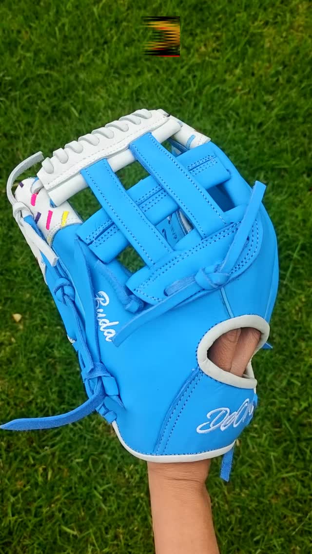 Stay cool under pressure. 🥶🧁 This custom build pairs a vibrant ice-blue leather shell with a clean white wrist and thumb accent, finished off with colorful embroidered sprinkles. Clean, crisp, and ready to freeze the competition on the diamond. ⚡Rate this ice-blue flavor from 1-10! 👇#deorosports #customgloves #baseball #softball #fyp #baseballlife #glovelove #baseballswag #glovecollector